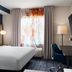Fairfield Inn & Suites by Marriott Sacramento Airport Natomas guest room with bed, desk, chair and window