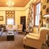 Evergreen Manor and Spa Stellenbosch lounge with leather sofa, armchairs, coffee table and window seating
