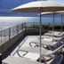 Hotel Atilius Adults Only terrace with loungers and lake view in Limone sul Garda