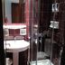 Gythion Hotel in Gytheio bathroom with glass shower, pedestal sink and mirror
