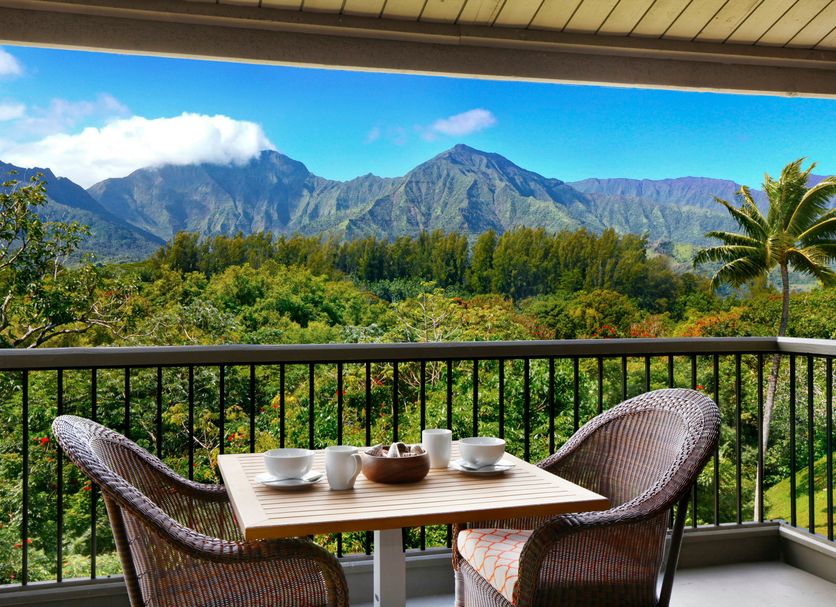 Hanalei Bay Resort in Princeville balcony with table, chairs and mountain view