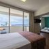 Castelmar Hotel in Florianopolis guest room with balcony ocean view and adjacent twin-bed room