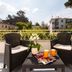 Terrace seating at Yourhome - Villa Sorrento in Meta with two chairs, table, flowers, and mountain views