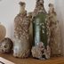 Fletcher Badhotel Egmond aan Zee decorative bottles on a shelf in a guest room