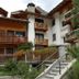 Residence Ruetoreif in Gressoney-Saint-Jean with alpine chalet-style balconies and mountain greenery