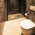 Hôtel Le Mosaïque in Narbonne bathroom with glass walk-in shower and wall-mounted toilet