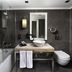 Mercure Istanbul Bomonti bathroom with bathtub, vessel sink vanity, wall mirror, and toilet