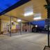 Cootamundra Gardens Motel in Cootamundra with covered driveway, entrance and parking at dusk