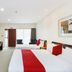 Fitzherbert Regency Motor Lodge in Palmerston North, twin beds and TV in a bright hotel room