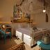 Hotel Haus Schons in Mettlach guest room with double bed, desk, chair, and boho decor