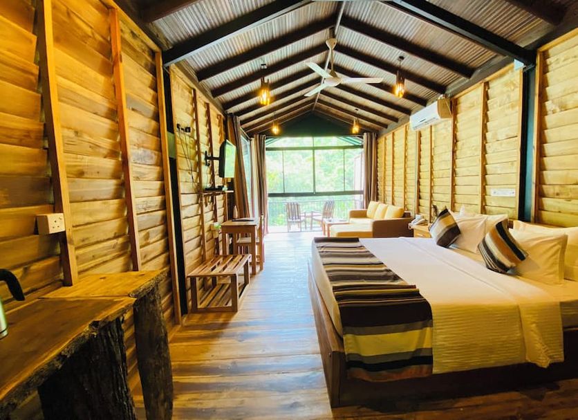The Glenrock Wellness Nature Resort Belihuloya lodge room with twin beds and forest-view balcony