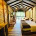The Glenrock Wellness Nature Resort Belihuloya lodge room with twin beds and forest-view balcony