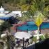 Hotel Paraiso Kora in San Blas with a pool, loungers, umbrellas, and palm trees