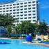 EGI Resort and Hotel in Lapu-Lapu City with outdoor pool and tall white hotel building