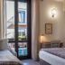 Hotel Il Tiglio in Castel di Sangro guest room with twin beds and a balcony door to the street view