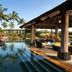 The Westin Princeville Ocean Resort Villas pool with tropical palms and a covered cabana in Princeville