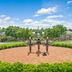 Hilton Vacation Club Greensprings Williamsburg: brick plaza with historic cannon and landscaped grounds