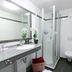 Hotel-Gasthof Zum Oberen Wirt bathroom in Regen with walk-in shower, sink, and wall-mounted toilet
