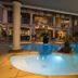 Club Cocomo, Hartbeespoort: lit courtyard pool with columns and outdoor seating