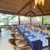 Magic Oceans Dive Resort in Anda outdoor dining area with set tables and wicker chairs