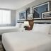DoubleTree by Hilton Long Island City New York guest room in Queens with two beds, desk and wall art