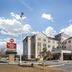 Best Western Plus Rose City Conference Center Inn in Thomasville exterior with entrance and sign under blue sky