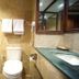 Benakutai Hotel and Apartemen Balikpapan bathroom with bathtub, toilet, sink, and mirror