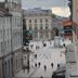 Hotel Les Portes D'Or in Nancy overlooking a city square with pedestrians and historic buildings