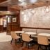 Hilton Garden Inn Jacksonville Ponte Vedra Sawgrass lounge with booth seating and round tables