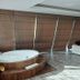 Golden Palas Hotel in Çerkezköy: room with round jacuzzi, lounge chairs and wood-look flooring