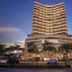 Vias Hotel Vung Tau in Vung Tau, modern high-rise hotel exterior at dusk with illuminated balconies