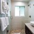 Crane's Beach House Boutique Hotel & Luxury Villas bathroom with glass shower, vessel sink and wall mirror