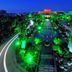 Paragon Hotel Xiangtan aerial night view of illuminated tree-lined driveway and garden