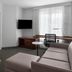Residence Inn by Marriott Santa Clarita Valencia suite with sofa, desk, TV and bedroom view