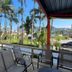 Hotel Arco Do Sol in Balneário Camboriú with palm-lined outdoor seating and a city view