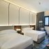 Nova M Olaya Hotel Edge By Rotana in Riyadh guest room with twin beds, city view and seating area
