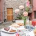 Alla Torre Del Barbarossa B&b Foresteria, Mandello del Lario: outdoor breakfast table in a courtyard