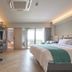 The Path Siam Bangkok guest room with king bed, desk, TV, and balcony view
