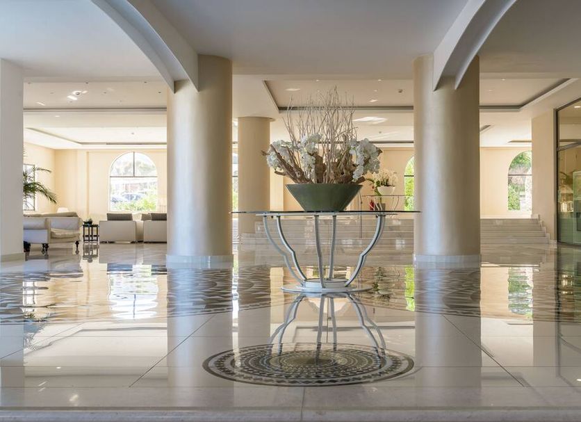 Lindos Village Resort & Spa - Adults Only lobby with reflective marble floors and decorative centerpiece in Lindos