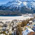 Grand Hotel Des Bains Kempinski in St. Moritz with snowy town and mountain lake views