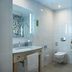 Hampton by Hilton Minsk City Centre bathroom with walk-in shower, toilet, and sink in Minsk