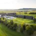 Der Öschberghof in Donaueschingen, aerial view of golf course, hotel buildings and surrounding green landscape