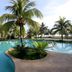 Gem Beach Resort in Kuala Terengganu with a curving outdoor pool and palm trees