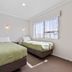 Knightsbridge Court Motor Lodge in Blenheim: twin single beds in a simple guest room with a window