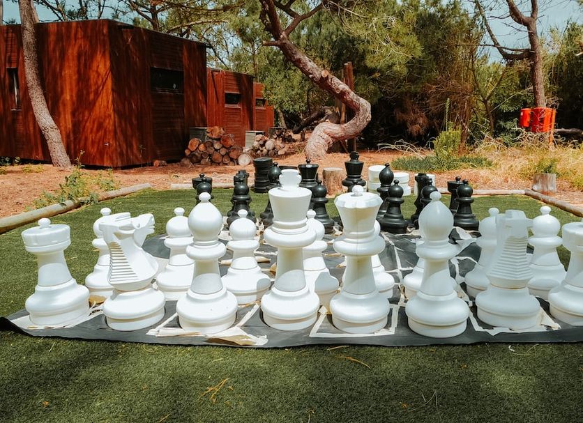 Azen Cool House in Azenhas do Mar with a giant outdoor chess set on grass