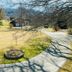 Terrell House B&B in Burnsville with landscaped lawn, circular path, and mountain views