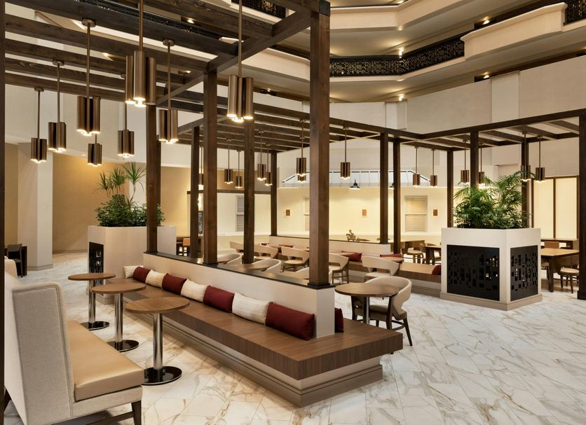 Embassy Suites by Hilton Phoenix Downtown North lobby with seating, marble floors and modern wood accents in Phoenix