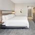 Holiday Inn Express & Suites Chicago West-O'hare Arpt Area by IHG room with king bed and wall-mounted TV