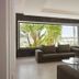 Christofinia Hotel in Ayia Napa lounge with large picture window, palm trees, and modern seating