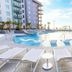 Holiday Inn Club Vacations Myrtle Beach Oceanfront By IHG pool deck with loungers and oceanfront views